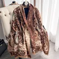 Brown cashmere-feel paisley shawl with fringe detail shown on a classic white chair - 185cm / Coffee Brown