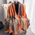 Detailed macro view of floral dot patterns and soft fringe on a thick winter pashmina - 185cm / Light Orange