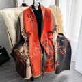 Dettaglio del motivo jacquard bambù su scialle spesso effetto lana arancione e beige - Arancione