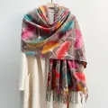 Autumn maple leaf print scarf with tassels over a cream coat on wooden hanger - Brown / Over 175cm
