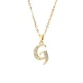 Macro detail of gold plated letter G pendant necklace with sparkling zircon inlay - Letter G / 14k