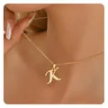 Close-up of gold cursive letter K pendant necklace with sparkling micro-pave zircons - Letter K / 14k