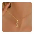 Detail of gold plated letter L pendant necklace with zircon stones on female model - Letter L / 14k
