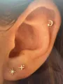 Close-up of gold-plated brass stud earrings featuring moon and star designs with zircons - Moon And Star Style (e1456) / 1 Card with 3 Pieces / Gold