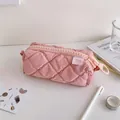 Detailed view of pink quilted fabric pencil case with large orange circular ring zipper pull - Pink