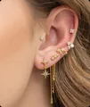 Detailed close-up of gold-plated tassel earrings with zircon stars and pearl accents - Starburst Tassel Earring Set (e586) / 14k / 6 Pieces/Set / Gold