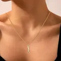 Detail of 18k gold plated brass bat pendant necklace on female model collarbone - Upside Down Bat Style (x344)