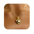Polished gold heart pendant necklace on a model featuring a minimalist 3D design - Mirror 3D Heart Style (x467) / 14k / Gold