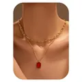Close-up of double layer gold necklace featuring a red square zircon pendant on model - Red