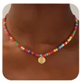 Colorful turquoise bead necklace with a golden round letter B pendant worn by model - Letter B