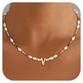 Detail of colorful beads and irregular pearl necklace with gold letter V pendant - Letter V