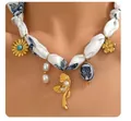 Detail of silk ribbon necklace with gold sunflower, butterfly and ceramic floral charms - Blue Floral Sunflower Silk Necklace (x546)