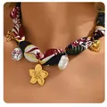 Detail of bohemian choker with colorful ribbon, golden flower charms and baroque pearl - Abstract Red and Black Fabric Porcelain Bead Necklace (x548) / 14k / Gold