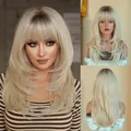 Long layered platinum blonde wig with dark roots and bangs on fashion model - Platinum