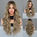Long wavy ombre ash brown wig with middle part and natural dark roots on model - 67cm / Bronze Gold Root Ombre
