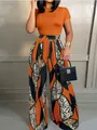 Women stylish two-piece set featuring orange short sleeve top and printed wide leg pants - Orange