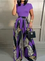 Detail of purple short sleeve top and high waist wide leg pants with leopard print - Purple
