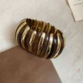 Detail of wide stretch bracelet with gold metal and amber resin bars on leather - Dark Brown Wide Elastic Bangle