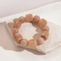 Close-up of light brown marbled acrylic beads showing round and cubic textures - Light Brown Marble Pattern Bracelet