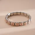 Macro view of modular stainless steel bracelet with golden retriever enamel patterns - Stainless Steel Golden Retriever Bracelet (Style 2)