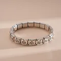 Close-up of stainless steel charm bracelet featuring a cute enamel French Bulldog pattern - Stainless Steel French Bulldog Bracelet (Style 4)
