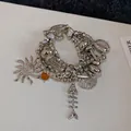 Silver multi-layer beaded bracelet with sun, starfish, and seashell charms for summer - Silver Multi-Layer Charm Bracelet