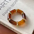 Amber acrylic beaded bracelet with gold metal ring accents in vintage style - Amber Retro Resin Bangle
