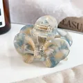 Elegant butterfly acetate hair claw with blue and beige marble texture and gold spring - 6cm / Floral Blue