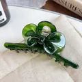 Translucent dark green acetate hair claw clip featuring an elegant bow design for women - 11cm / Dark Green