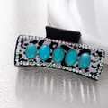 Detail of leopard print hair claw with turquoise stones and rhinestone accents - Leopard Five Turquoise Style (F731-15)
