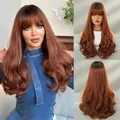 Long wavy copper brown wig with bangs featuring dark roots and natural gradient finish - Copper Brown (Ombre)