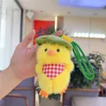 Close-up of plush yellow chick keychain featuring a green leaf hat and red plaid scarf - Without Bag