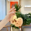 Macro detail of plush avocado keychain featuring soft faux fur and premium gold clasp - Sweet Potato (With Gold Buckle)