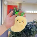 Gros plan d'un porte-clés en peluche mangue jaune avec visage souriant et feuille verte - Chaîne Simple / Mangue
