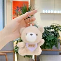 Detail of plush bear keychain with purple polka dot scarf and YYDS leather label - Hanging Chain / Khaki