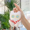Cute white plush cat keychain with colorful eyes and a red scarf held by a hand - Approx. 12cm / White / Red Scarf / Gold Clasp