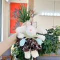 Detail of white plush bunny pendant in floral dress with soft faux fur texture - Removable Dress
