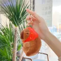 Plush capybara keychain with red strawberry hat and golden alloy hook for bags - Strawberry Capybara with Gold Buckle
