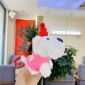 Close-up of white plush Westie dog charm wearing pink sweater and red knitted hat - Rose Red Clothing / 12cm