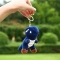 Detail of a dark blue plush dinosaur keychain hanging outdoors with green blurred background - 11cm / Gold Keychain / Dark Blue