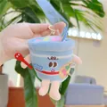 Close-up of a plush instant noodle cup keychain with cute face and red spoon detail - Instant Noodles With Gold Clasp / 9.0cm