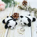 Detailed view of two cute panda plush charms on a warm wooden surface with decor - Ordinary Style (Without Pin)