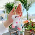 Detailed close-up of a plush unicorn keychain with rainbow mane and golden horn detail - Plain Chain / White / 12cm x 9cm