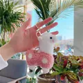 Close-up of cute pink and white alpaca plush keychain with golden metal hook and ring - Gold Metal Buckle / Pink