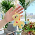 Yellow unicorn plush keychain with rainbow mane and embroidered hearts in a natural setting - Plain Chain / Yellow / 12cm x 9cm