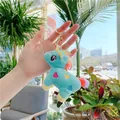 Detail of blue plush unicorn keychain with rainbow mane and golden lobster clasp - Gold Clasp / Green / 12cm x 9cm