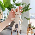 Close-up of cute off-white plush bunny keychain with knitted texture and heart details - Cream White - Silver Bead Chain