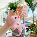 Close-up of pink plush unicorn keychain with colorful heart embroidery and gold clasp - Gold Clasp / Pink / 12cm x 9cm