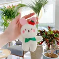 Detail of white plush cherry bear rabbit keychain with green bow and red cherry accents - Standard Chain White Rabbit