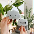 Close-up of cute light blue plush cloud hair clip with smiling embroidery and metal clip - Hair Clip Style / Blue